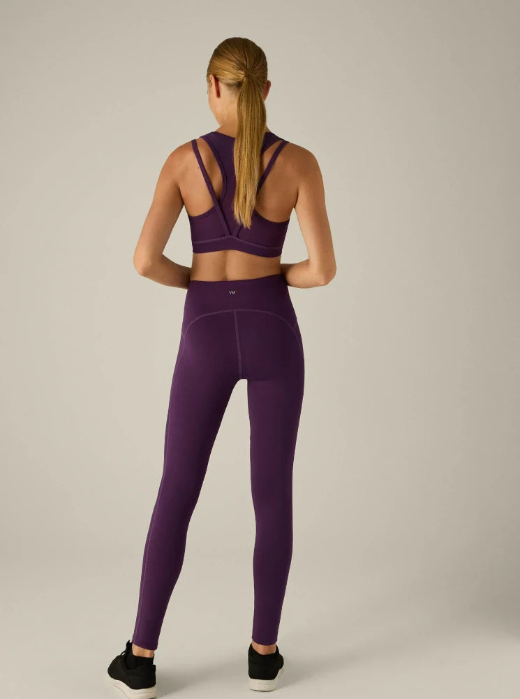 Leggings deportivo bolsillo interior y detalles laterales violeta